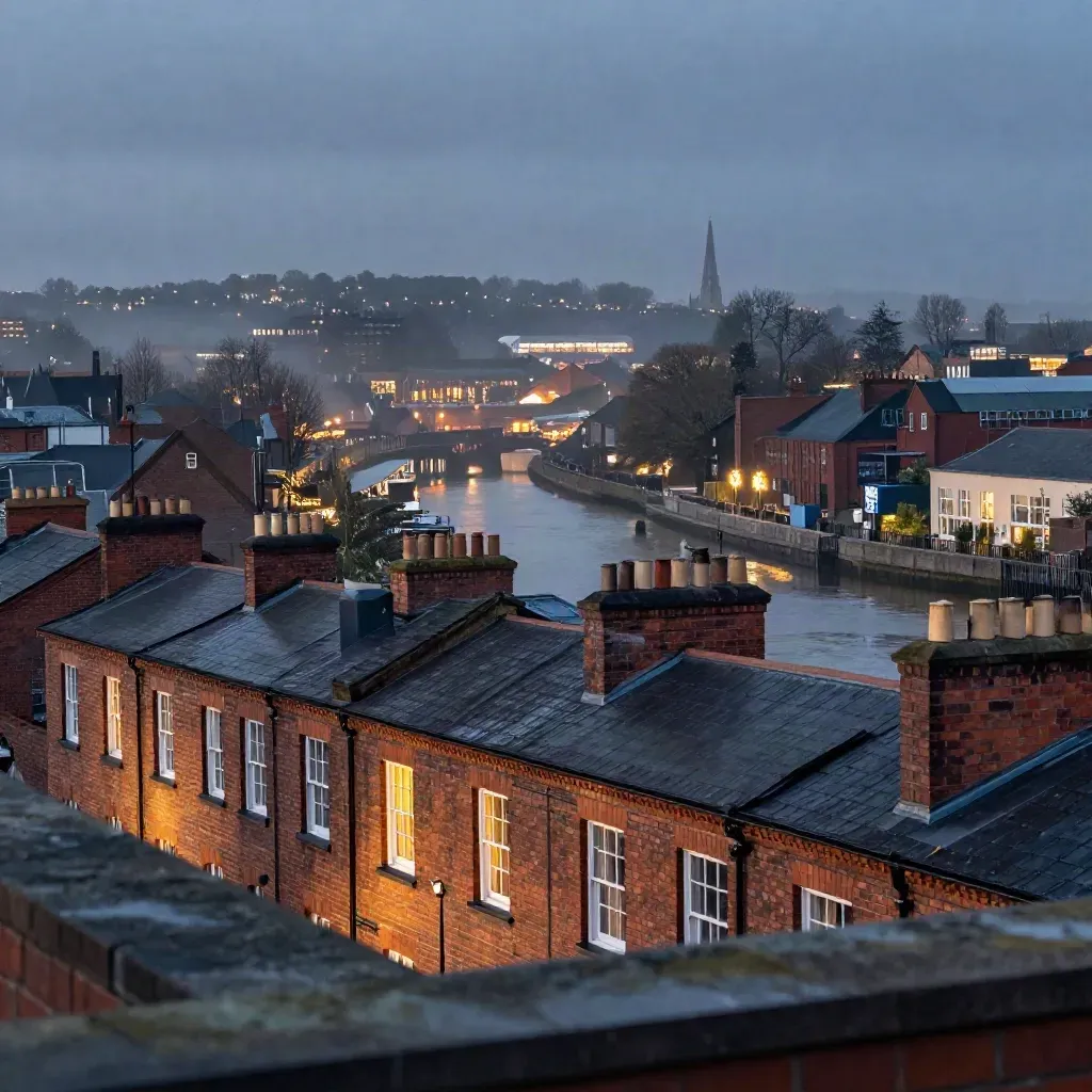 Blue-hour West Midlands skyline over terraces, canals and misty rooftops